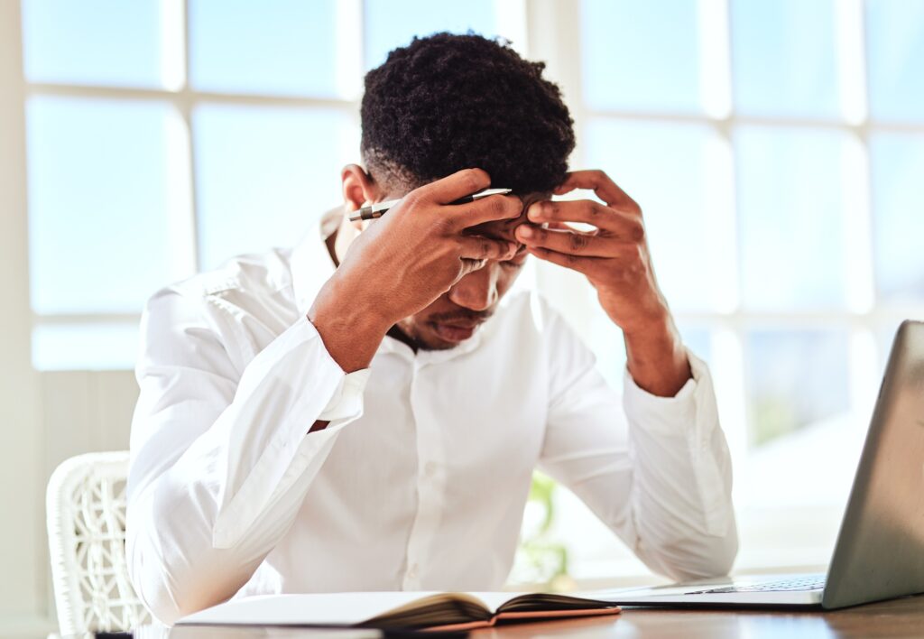 Headache, stress and businessman with burnout from work problem in office. Sad and tired corporate